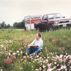 Sitting pensively in a Texas field