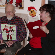 Christmas Eve at Dean and Kathy's , Dad playing Christmas songs.......