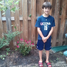 Jake in front of his Papo's Memorial Garden we created.  It has started with a rosebush.