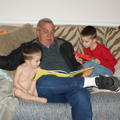 Dad reading to his grandkids Caden and Caleb thanksgiving 2009