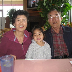 Mom, Emma and Dad waiting for lunch