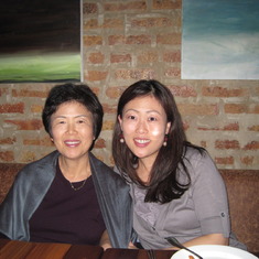 Mom and Helen enjoying delicious food in Chicago, March 2010