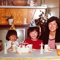 Mom celebrating Julie's fifth birthday with Julie and Helen, February 24, 1979