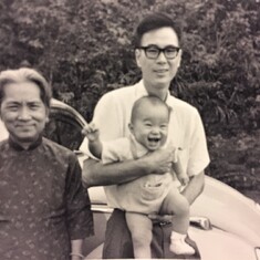 Some little girl sure was bowled over in her Daddy's arms! Three generations, with Grandma.