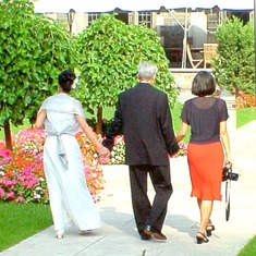 Dad strolling thru Hart House garden with the twins on Priscilla's wedding day.