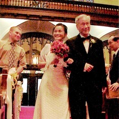 Priscilla walking down the aisle with Dad