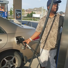 Dad learning to pump gas in Canada
