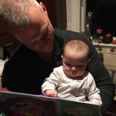 Reading to baby Grace