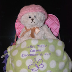 Teddy bear I got so I never have empty arms & blanket made for me by support group.