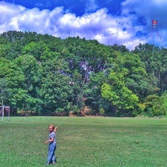 My girl flying a kite and so proud. 
