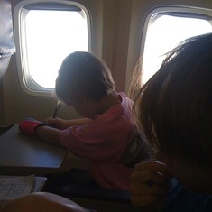 On the plane to Florida.  She was perfect and did schoolwork the whole time
